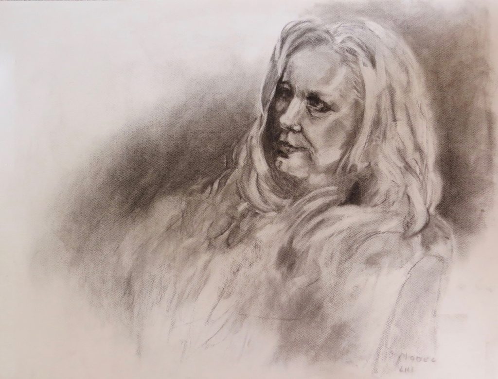 A charcoal drawing of a woman by Odette Laroche in Sidney, BC.